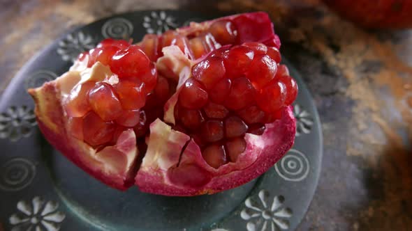 Chopped Pomegranate Rotating on a Table alt