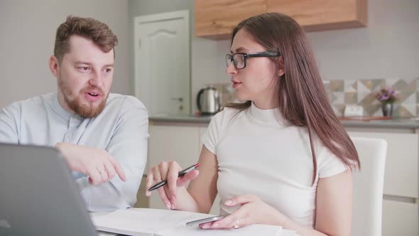 Adult Caucasian Couple at Home in Smart Working and Remote Work Job Activity Sitting at the Desk in