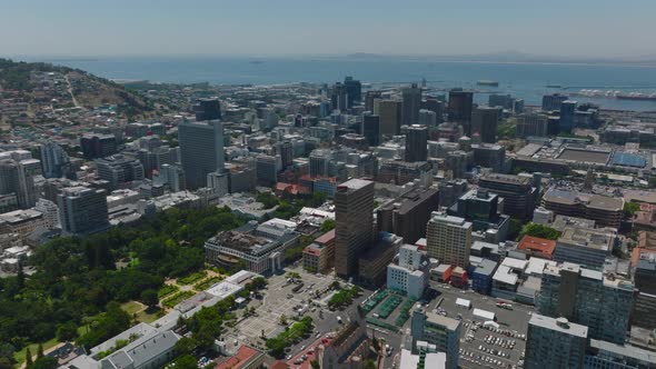 Aerial Descending Shot of Tall Buildings in Modern City Borough alt