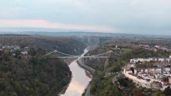 Circling drone shot of the Clifton suspension bridge Bristol at sunset alt