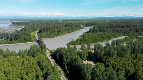 4K Drone Video of Alaska Railroad Train Trestle with Mt. Denali in Distance during Summer alt