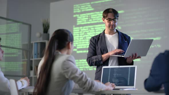 IT Teacher With Laptop Giving Lesson alt