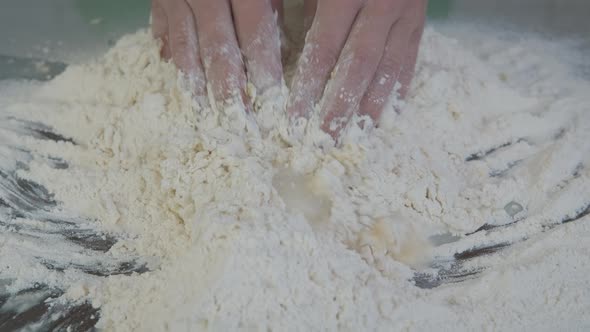 Add water in the flour. alt