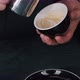 Barista pouring milk in hot coffee and making cappuccino foam in cafe close up, vertical - VideoHive Item for Sale