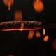 the fried sausage is put on a skewer and hangs over the open flame of the fire. - VideoHive Item for Sale