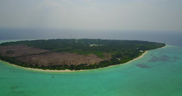 Wide angle flying travel shot of a summer white paradise sand beach and turquoise sea background in  alt