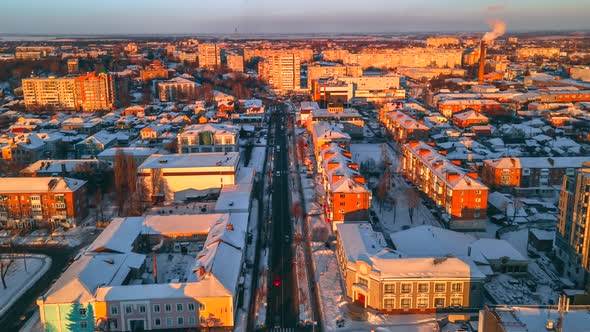 Hyperlapse of Car Traffic on Road Passing Through Town at Winter Sunny Evening alt
