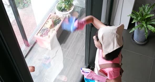 Woman doing housework at home alt