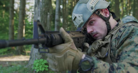 Soliders Aiming Assault Rifle and Protecting Military Base alt