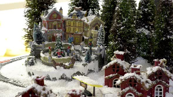 Toy Christmas city with training under snow. Flat plane alt