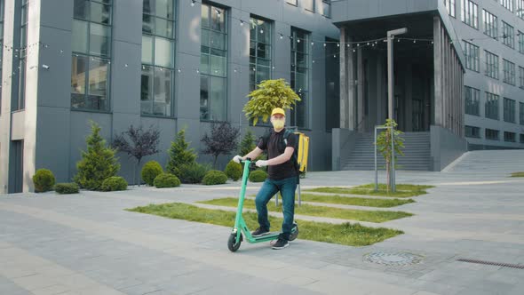 Handsome Guy Young Man in Protective Sterile Medical Mask on Electric Urban alt