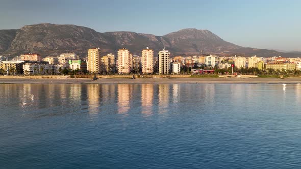 Reflection of the city in the sea aerial view 4 K alt