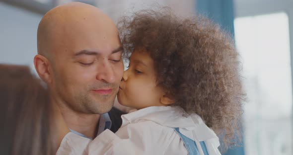 Father is playing with his daughter Mom is playing with her little daughter Turkish family alt