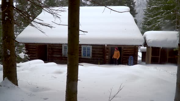 Backpacker Hiking in Winter Forest alt