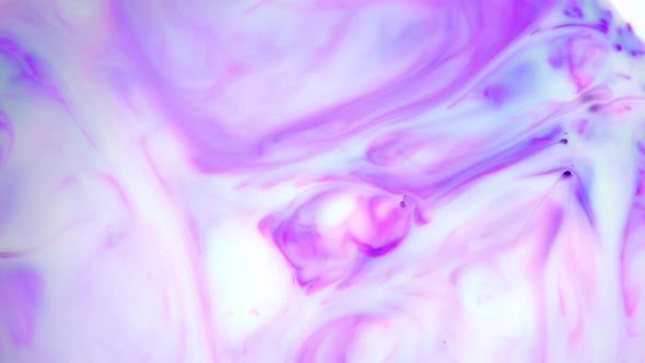 Ink in Water. Purple Ink Reacting in Water Creating Abstract Background. alt