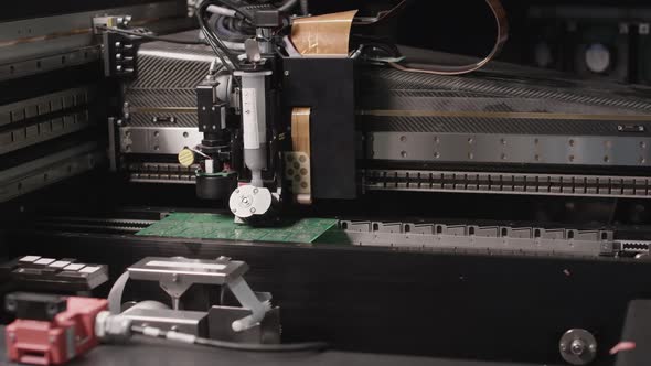 A Machine is Soldering Printed Circuit Boards
