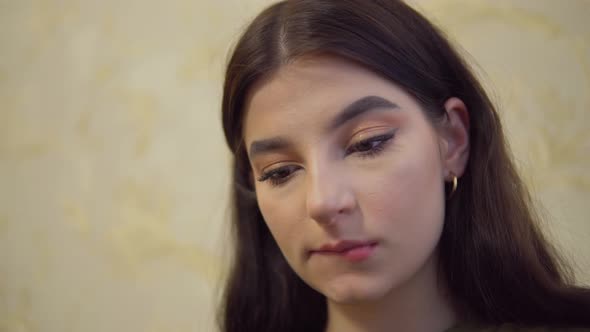 Artist Girl Tucks Hair Behind the Ear Dirty Hand in Coal Draws Painter