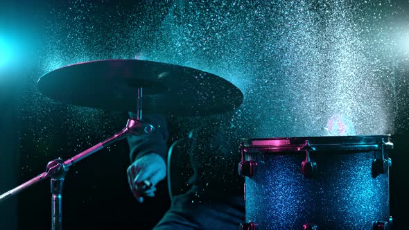 Super Slow Motion Shot of Drum Hit and Splashing Water at 1000 Fps alt