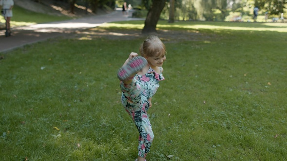 Portrait of Little Girl Smiling. Child Having Fun in Park. Childhood. Jumping, Fighting, Dancing alt