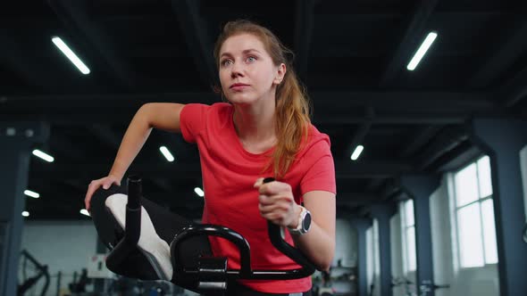 Group of Girls Performs Stretching Training Workout Cardio Routine on Bike Simulators Cycle Training alt