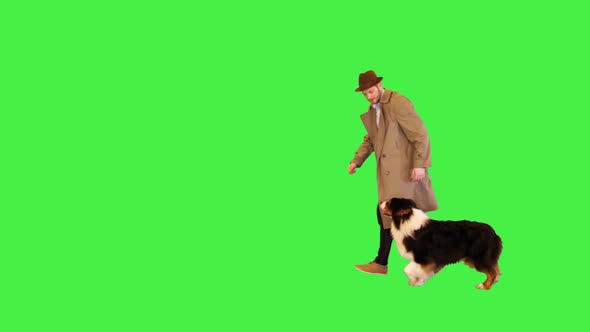 Detective Running with His Australian Shepherd Dog on a Green Screen Chroma Key