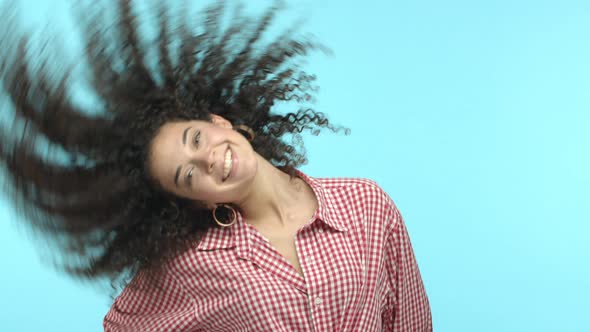 Slow Motion of Beautiful Young Woman with Happy Smile Whip Hair and Shaking Head Joyfully Showing