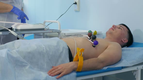 Nurse Performing ECG on a Male Patient alt