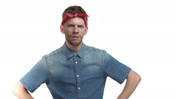 Video of Young Hipster Guy with Beard Wearing Red Headband and Denim Shirt Looking Frustrated Being