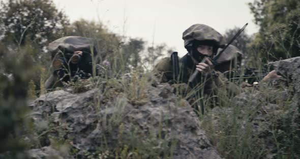 Israeli soldiers in a surveillance and reconnaissance mission using binoculars alt