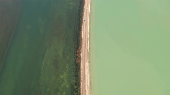 The lake with a path in the middle. alt