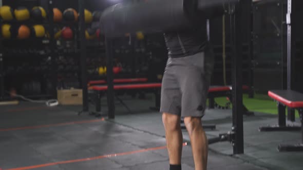 Powerful Athlete Raising Weights Up Using Sportive Equipment alt