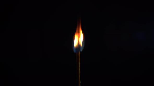 Match Burning in the Dark