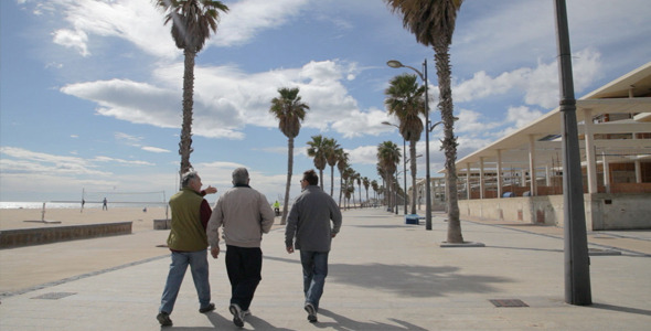 Three Men Walk Near The Beach