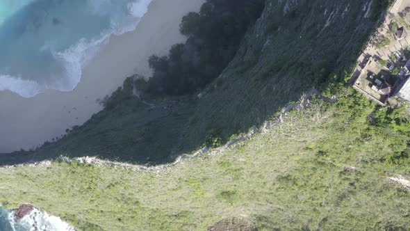Nusa Penida island Kelingking Beach in Indonesia T-Rex peninsula with descending cliff staircase, Ae alt