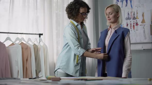 Seamstress Customizing Coat According to Client Professional Clothes Modeling alt