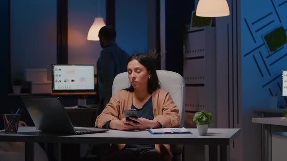 Businesswoman Working in Startup Business Company Office Sitting at Desk alt