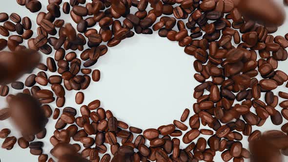 Coffee Beans Falling Down Forming Circular Space For Logo Or Sign