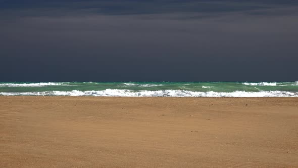 Tropical Unmanned Beach Before Approaching Storm in Sky alt