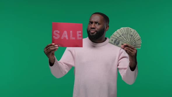 Amazed Young African American Man Guy in Casual Hold Sign with SALE Title and a Wad of Dollars, on alt