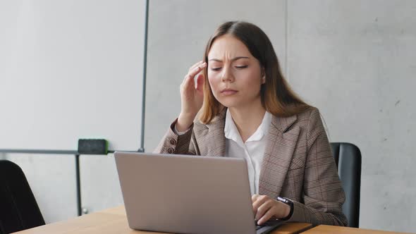 Young Millennial Caucasian Business Woman Manager Worker Girl Student Sitting in Office Typing alt