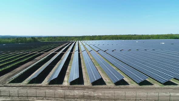 Aerial View of Solar Power Station Field at Sunny Day. Aerial Top View of Solar Farm. Renewable