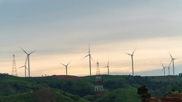 Footage B-roll timelapse power farm wind turbine while sunset time