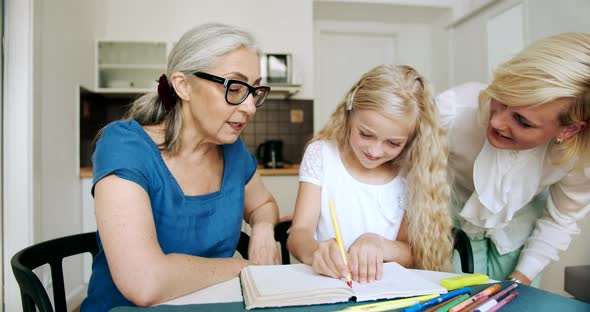 Grandmother with Daughters in Kitchen