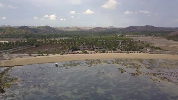 Lonely boat at a deserted small villageMarvelous aerial view flight fly forwards drone footage of M alt