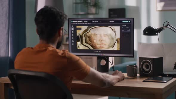 Anonymous Man Editing Cosmonaut Picture alt