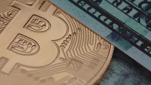 Bitcoin and Dollars Lie Side By Side