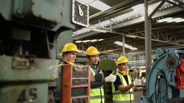 Technician team and chief mechanical engineer successful to repair old machinery