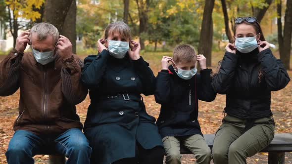 Family Puts Medical Masks on Their Faces.