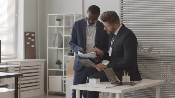 Investment Managers Developing Trading Strategy in Office alt