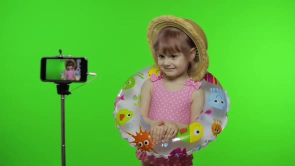 Girl Child Makes Selfie Vlog, Blogging, Video Call on Mobile Phone. Vacation Sea alt